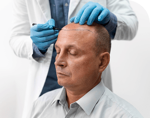 Doctor drawing on patient head mobile